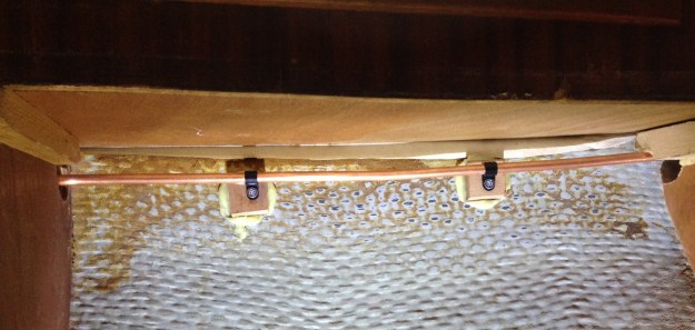 Gas pipe fixed to shims