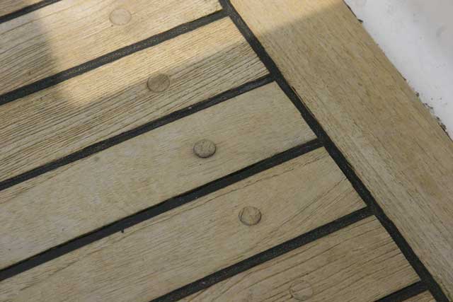 With decking that is very thin, the plugs over the fastenings are even thinner and can lift if the glue fails